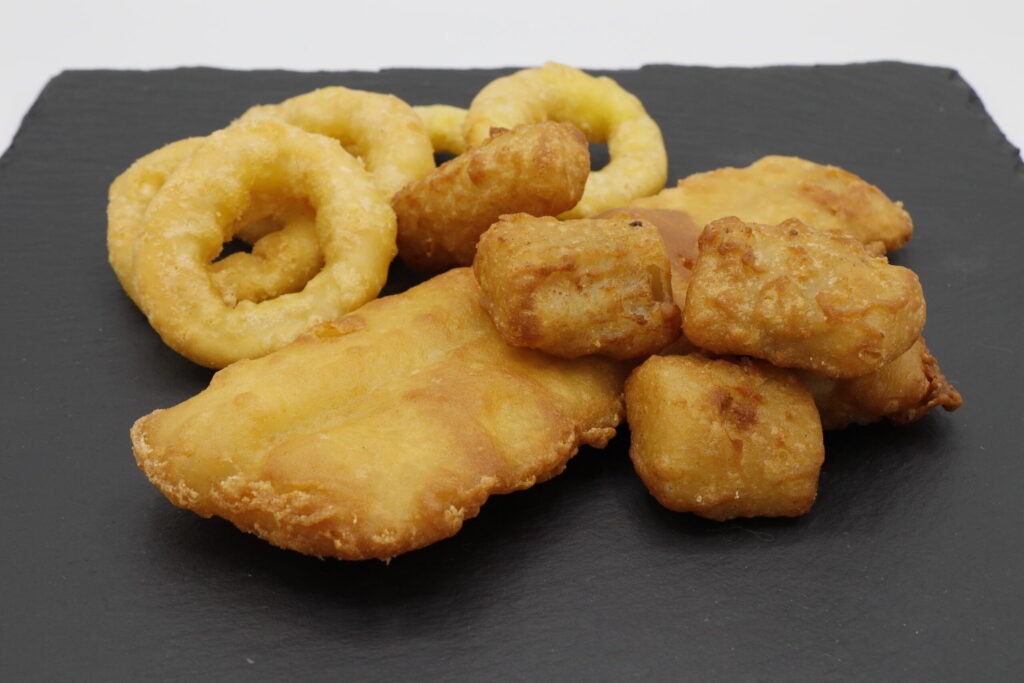 Fischgerichte vom Imbiss Fritz in Bielefeld: Zartes Alaska-Seelachsfilet, knusprige Kibbelinge und mehr – frisch zubereitet für echten Genuss.