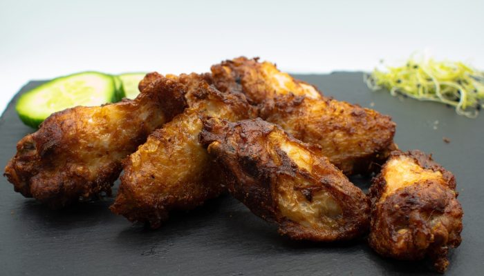 Chicken Wings BBQ vom Imbiss Fritz in Bielefeld: Zarte, würzige Hähnchenflügel mit einem Hauch von BBQ-Aroma – perfekt für echte Geflügel-Liebhaber.